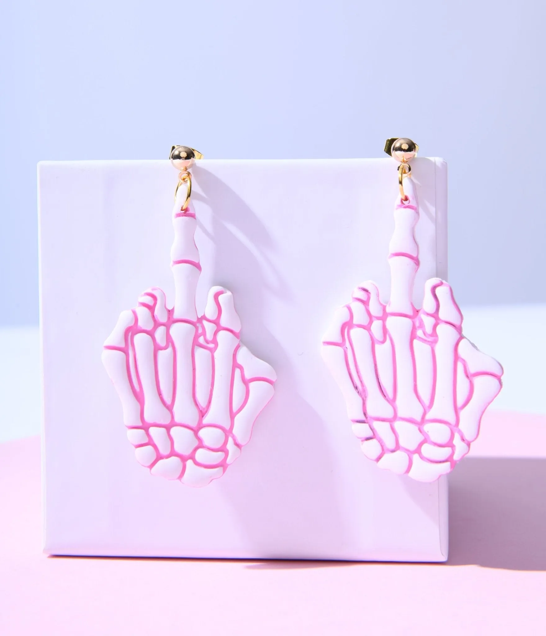 White & Pink Middle Finger Skeleton Earrings